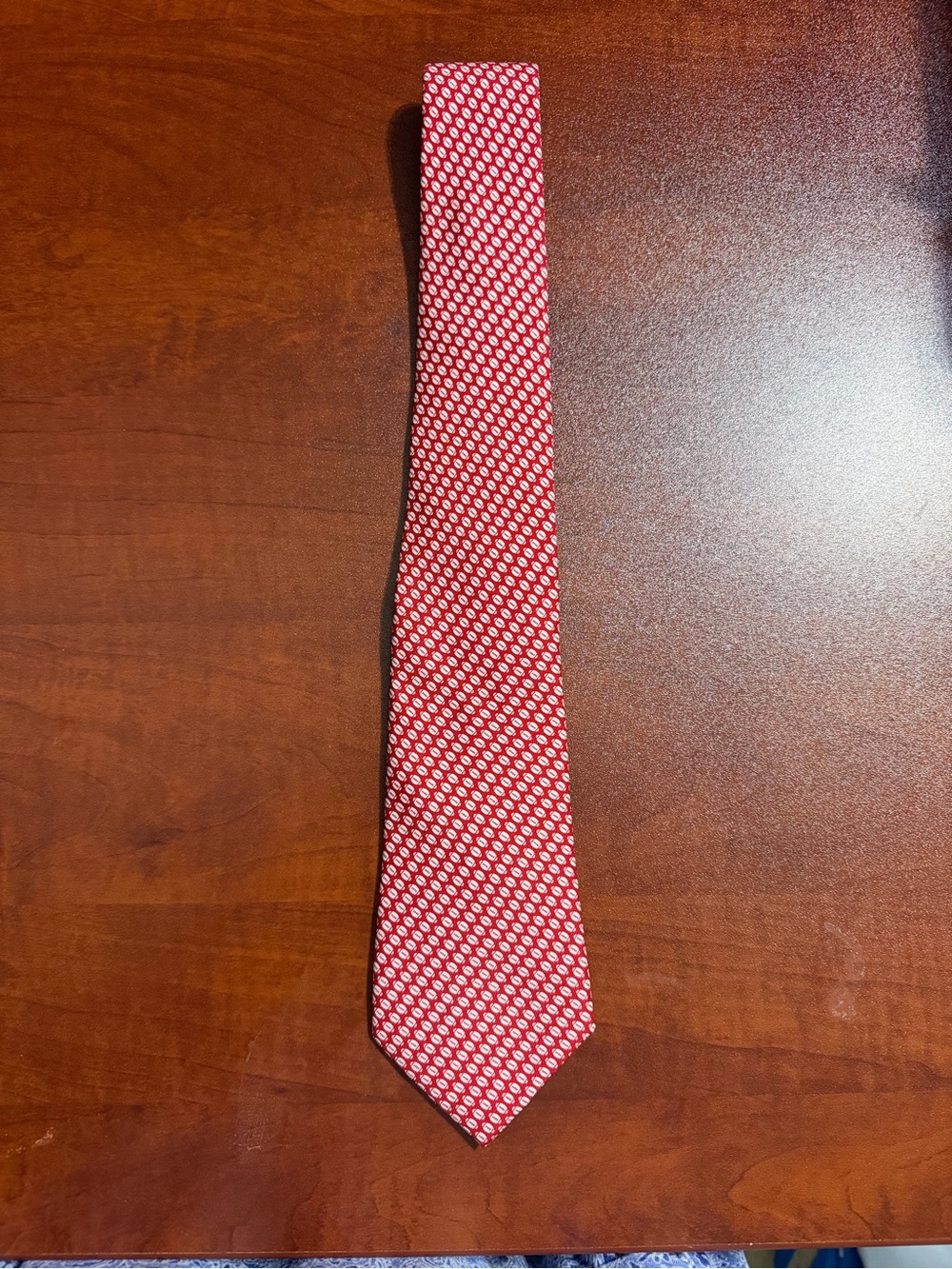 Vineyard Vines "Hand Picked by Shep & Ian" silk football tie.